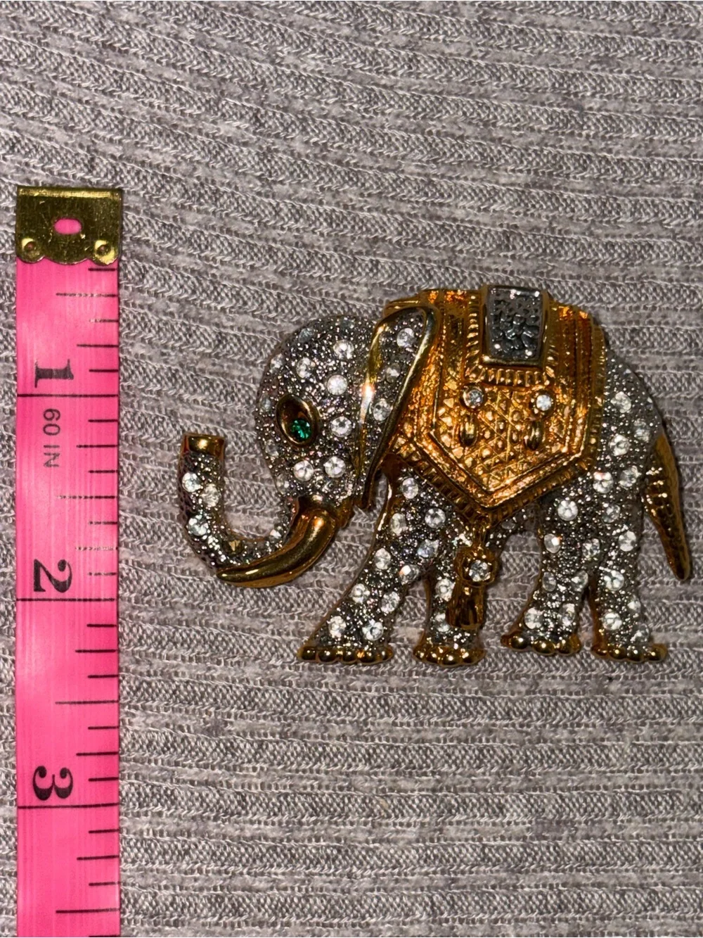 Vintage gold tone clear rhinestone encrusted elephant brooch w green rhinestone